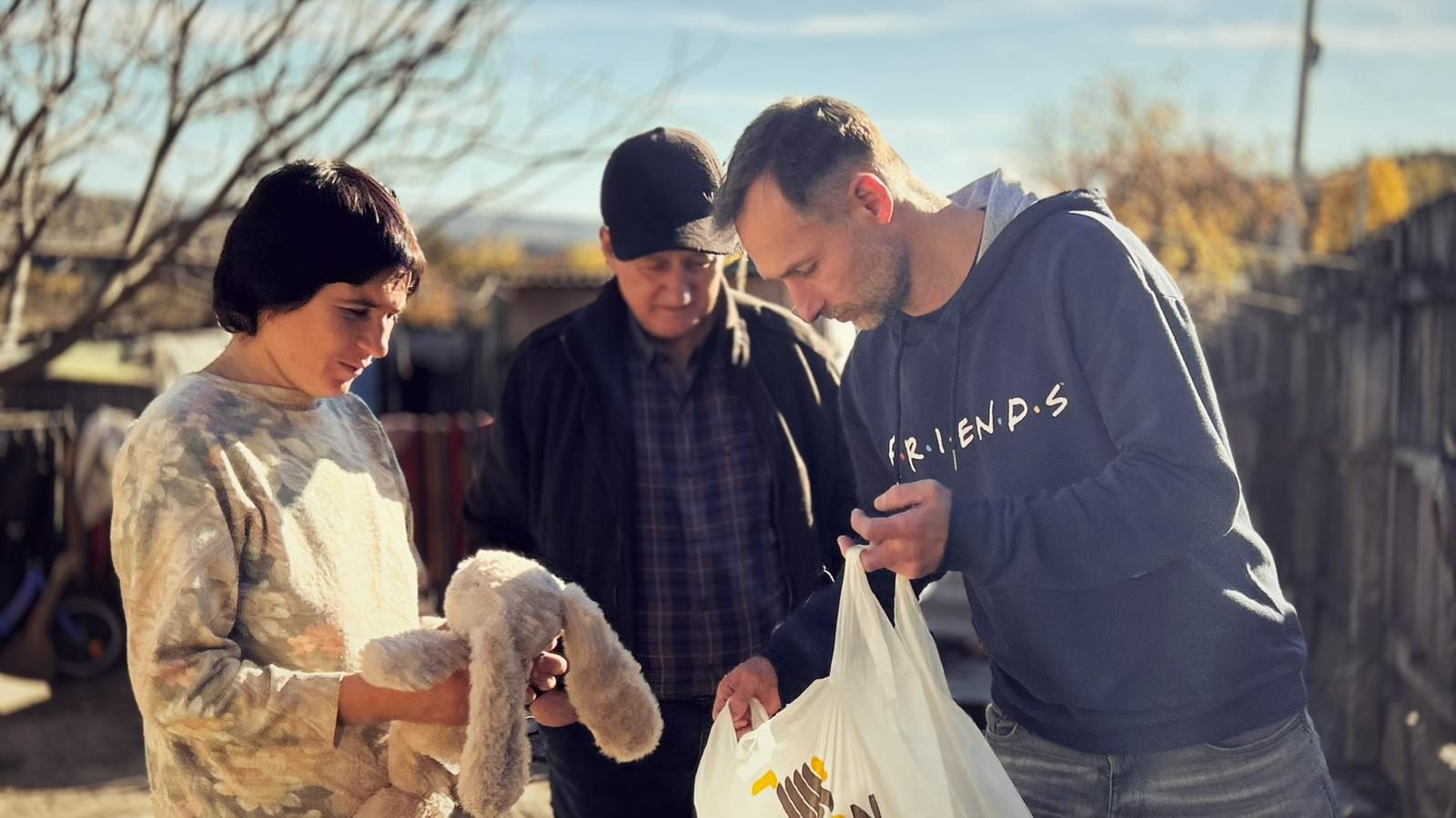 Volunteers handing over a gift bag in Moldova